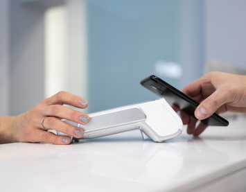 customer-paying-by-smartphone-with-nfc-technology-new-q9k7g3y7p6vlvfifjbjdxml1hoyvnnsk2cn2imge4y (1)